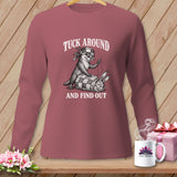 Mauve long-sleeve t-shirt with a graphic of an otter sewing a rabbit into a quilt, reading Tuck Around And Find Out.