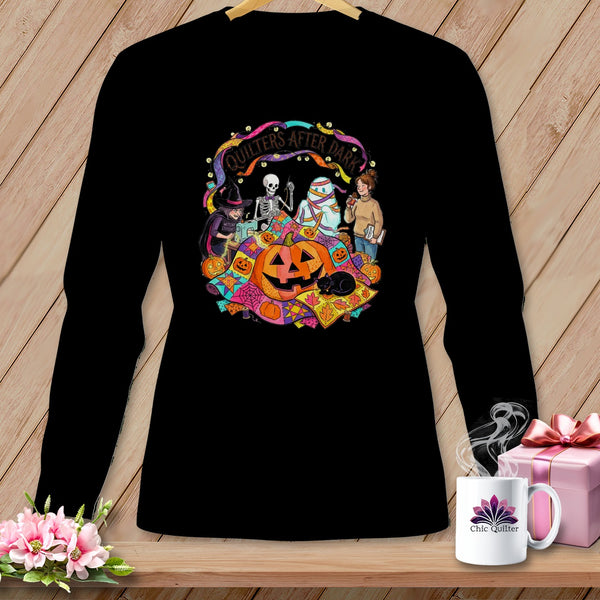 Black long-sleeve shirt with a Halloween quilting graphic and text "Quilters After Dark."