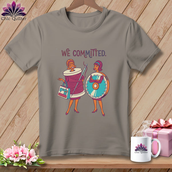 T-shirt with cartoon of two women, one with a spool of thread, the other with a saw blade.