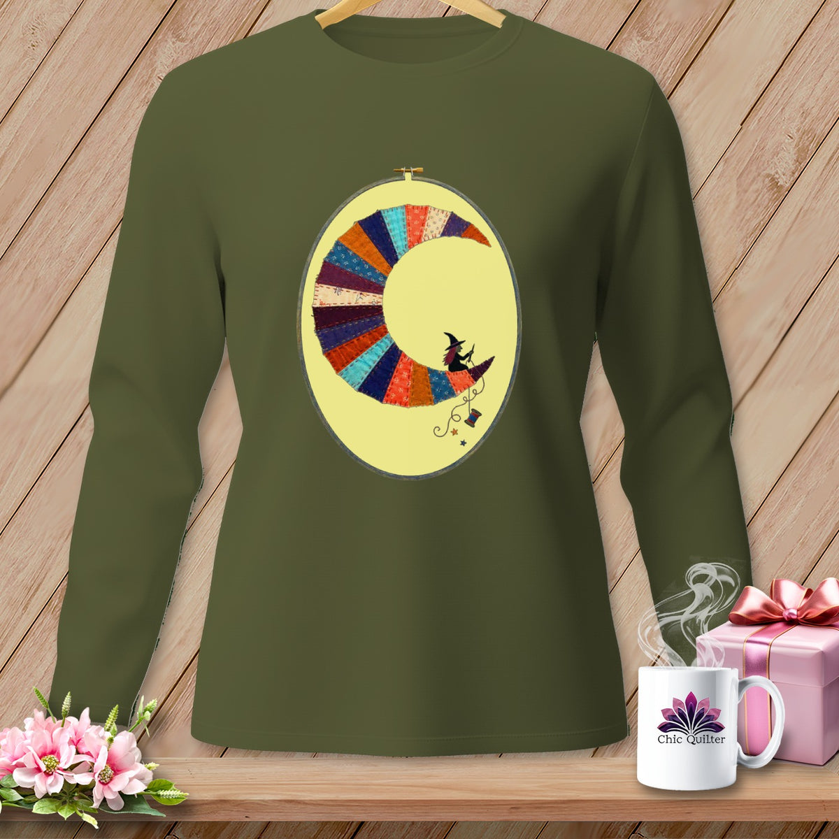Long-sleeve shirt with a crescent moon quilt design featuring a witch riding a broom.