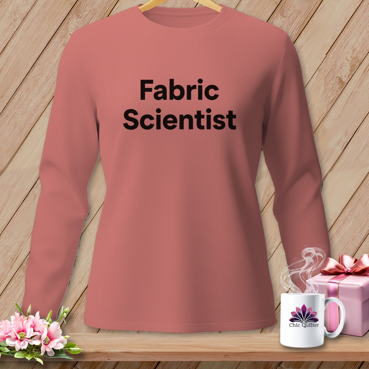 Pink long-sleeve shirt with "Fabric Scientist" text, mug, and gift box.