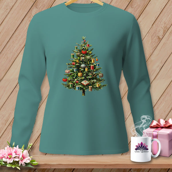Teal long-sleeve shirt with a Christmas tree decorated with spools of thread and sewing notions.