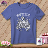 A periwinkle t-shirt with a humorous graphic of a duck wrapped in a tattered patchwork quilt, featuring the text 