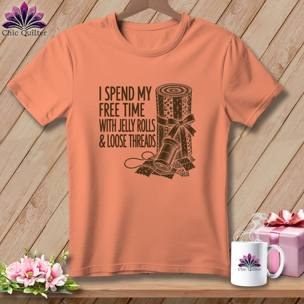 Coral t-shirt with "I spend my free time with jelly rolls & loose threads" text.