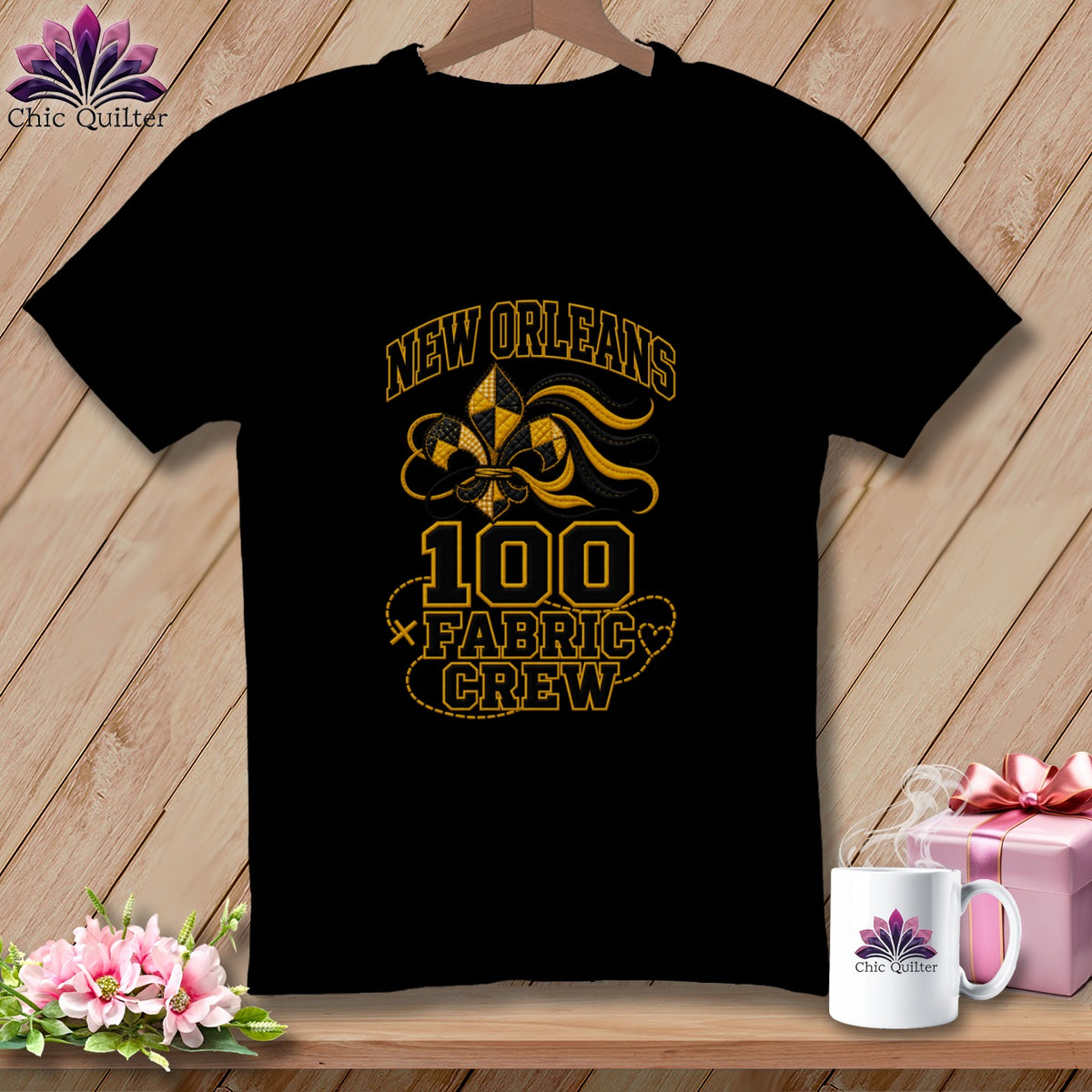 Black t-shirt featuring a New Orleans 100 Fabric Crew design with a fleur-de-lis motif.