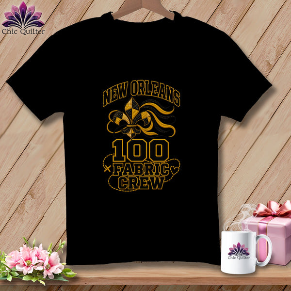 Black t-shirt featuring a New Orleans 100 Fabric Crew design with a fleur-de-lis motif.