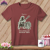 Maroon t-shirt with a bird holding scissors and a scrap bin, text 