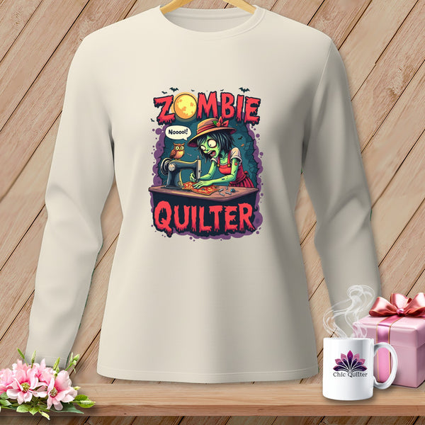 Zombie quilter graphic with text "Zombie Quilter" on a cream long-sleeve shirt.