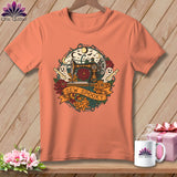 Orange t-shirt with sewing machine, ghosts, and 