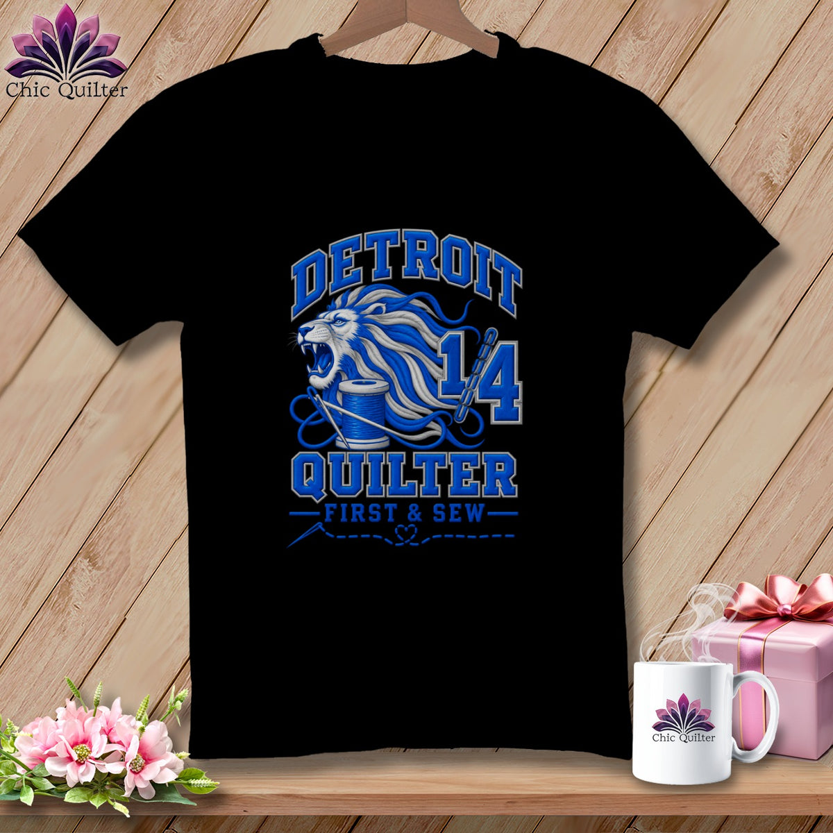 A black t-shirt featuring a blue lion design, the text Detroit Quilter, and sewing graphics.