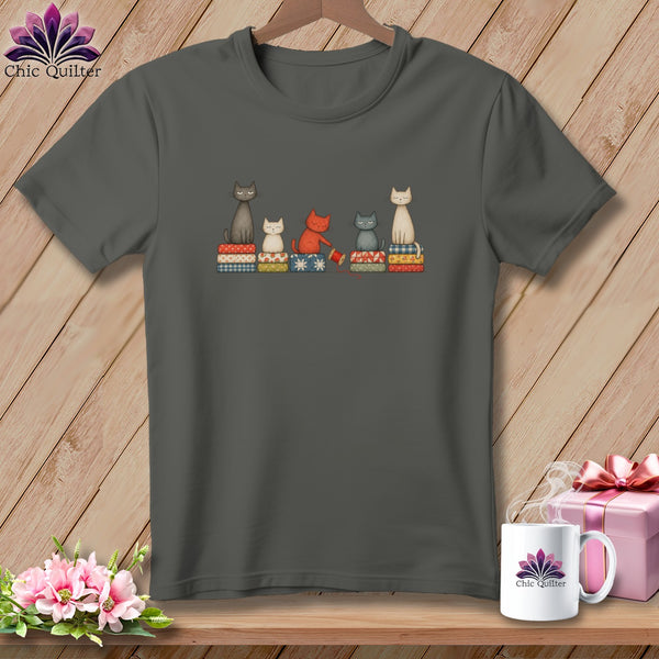 Dark gray crewneck t-shirt featuring an illustration of five cats sitting on quilted blocks.
