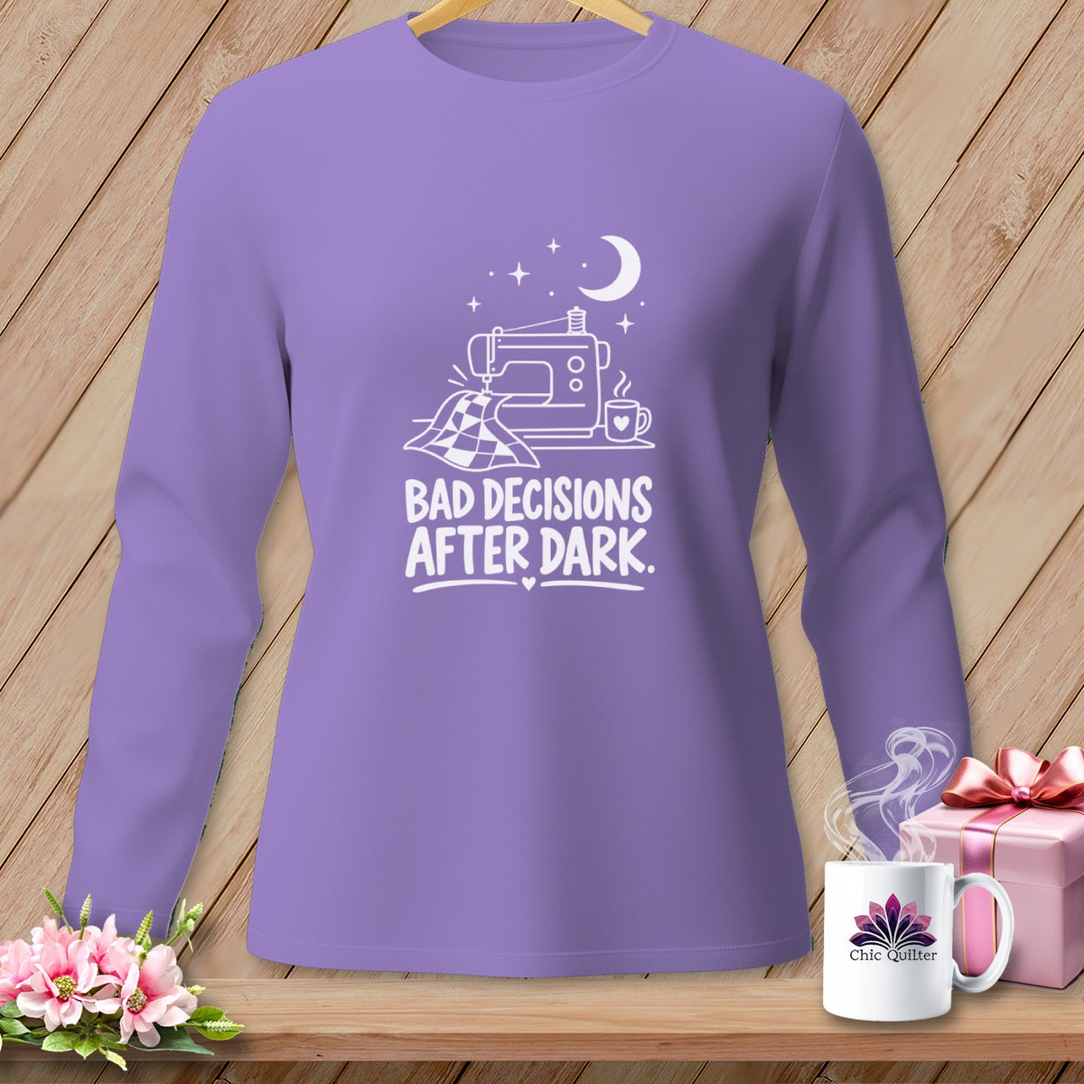 Lavender long sleeve shirt with sewing graphic and text "Bad Decisions After Dark."