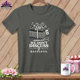 Gray t-shirt with stack of fabric, measuring tape, scissors, and 