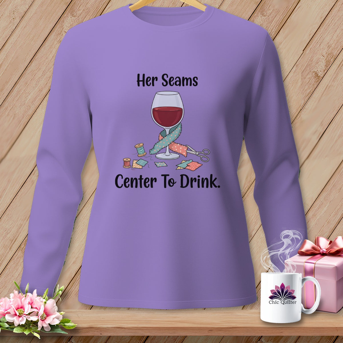 Purple long-sleeve shirt with "Her Seams Center To Drink" graphic.
