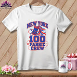 A white t-shirt on a wooden background with text reading New York 100 Fabric Crew.