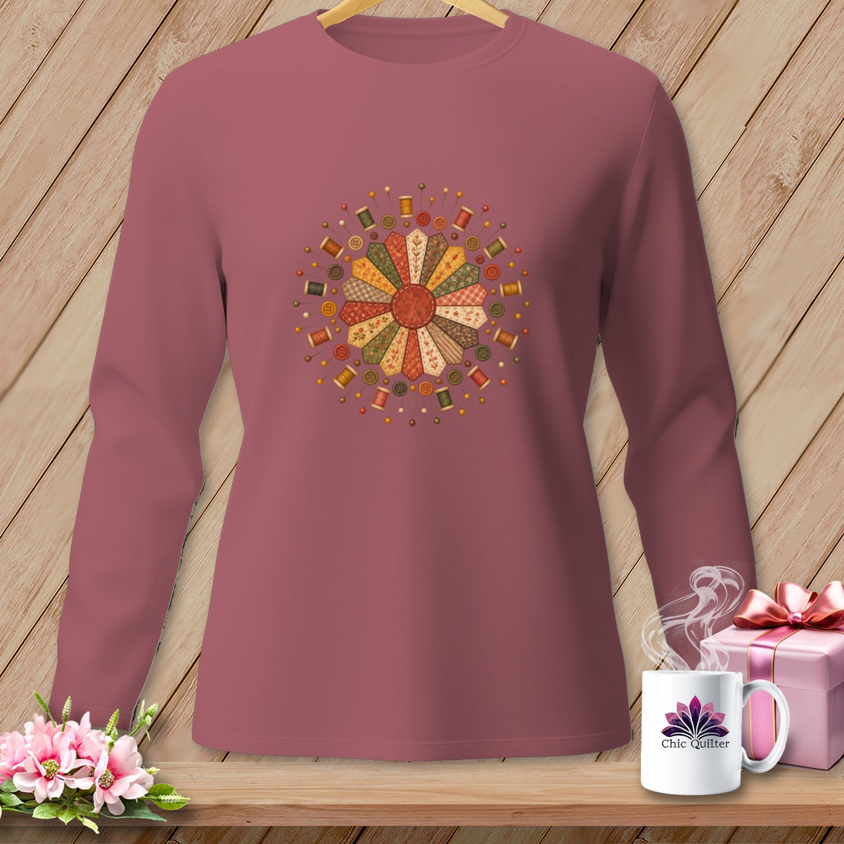 Long sleeve shirt with a circular patchwork quilting design and sewing notions.