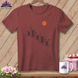 Maroon t-shirt with spools of thread graphic and an orange button.