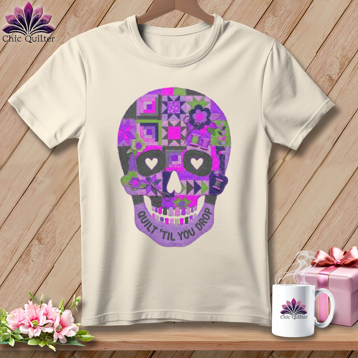 Cream t-shirt with purple quilt-style skull graphic and text "Quilt 'Til You Drop".