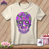 Cream t-shirt with purple quilt-style skull graphic and text 