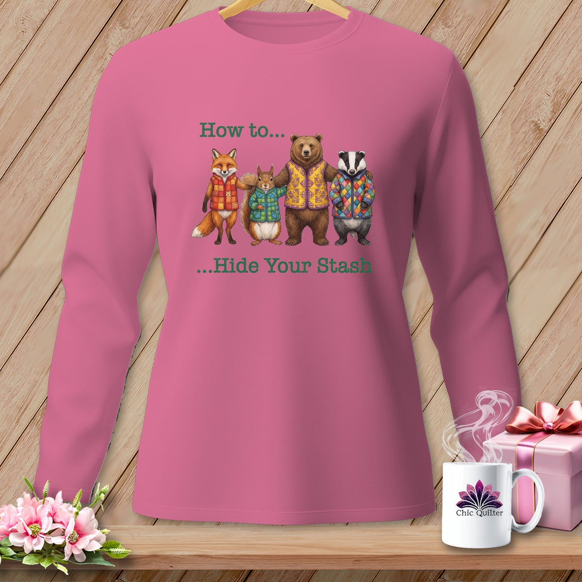 Pink long-sleeve shirt with fox, squirrel, bear, and badger in quilted vests, text "How to... ...Hide Your Stash".