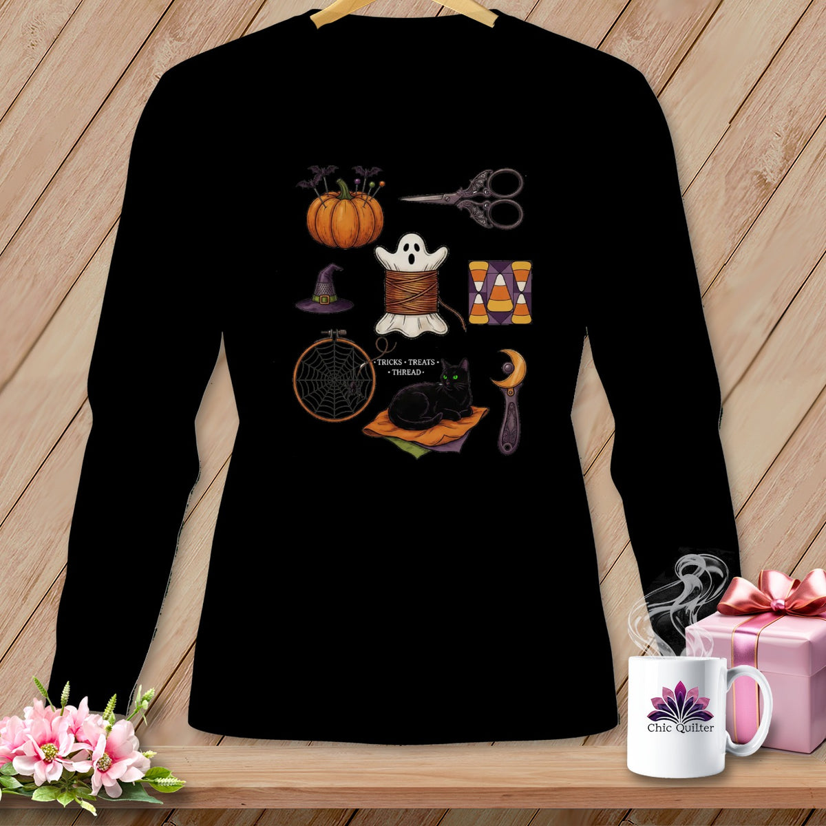 Black long sleeve shirt with Halloween sewing and crafting icons.