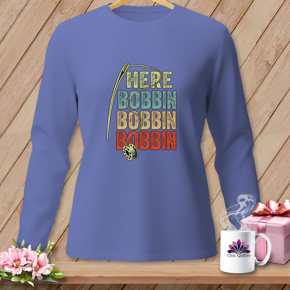 Long sleeve shirt with "HERE BOBBIN BOBBIN BOBBIN" text and sewing needle and bobbin graphic.