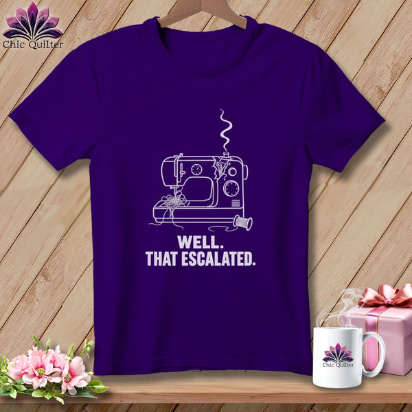 Purple t-shirt with white line art of a sewing machine and the text "WELL. THAT ESCALATED."