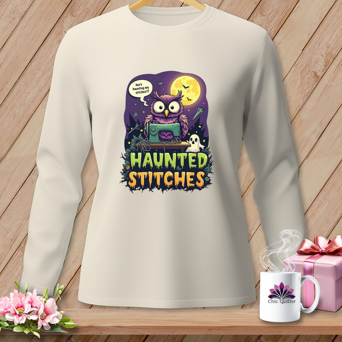 Light cream long-sleeve shirt with a Halloween graphic of an owl sewing and "Haunted Stitches" text.
