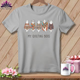 Grey t-shirt with five quilted ghosts and text 