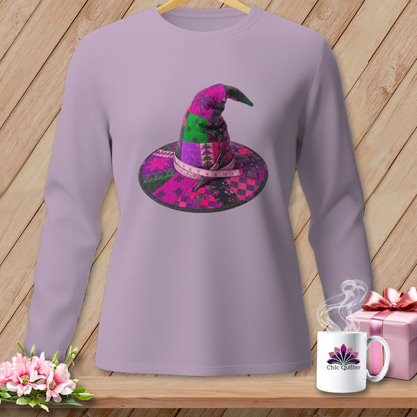Quilted witch hat with scissors and measuring tape graphic on a lavender long-sleeve shirt.