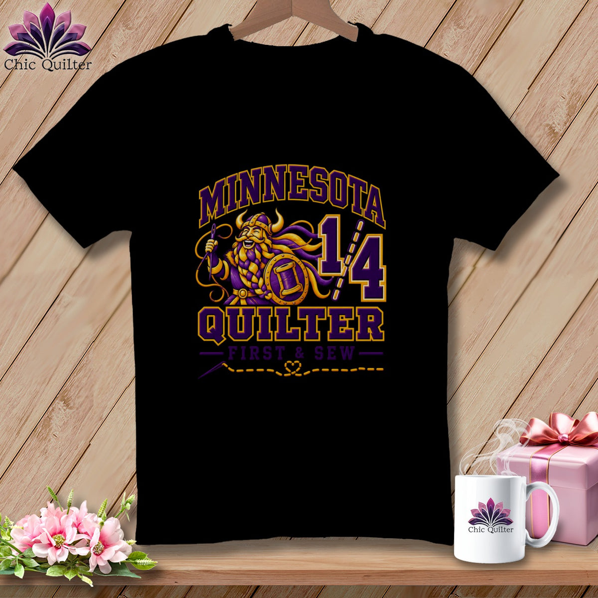Black t-shirt featuring a purple and yellow Minnesota Quilter graphic with a Viking design.