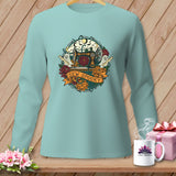 Light blue long sleeve shirt with a circular Halloween sewing design.