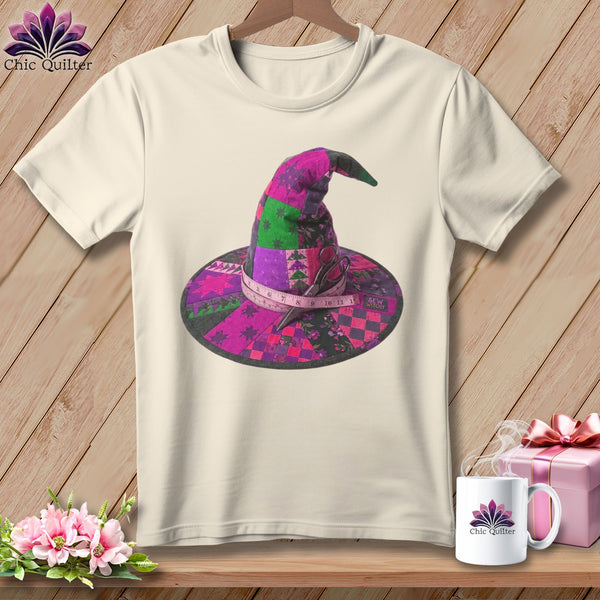 Quilted witch hat with measuring tape and scissors, on a cream t-shirt.