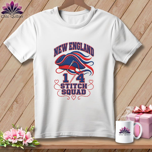 White t-shirt with a blue and red graphic featuring the text New England 1/4 Stitch Squad.