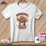 A white t-shirt hanging on a wooden background, featuring a graphic with a Viking and the text Minnesota Stitch Squad.
