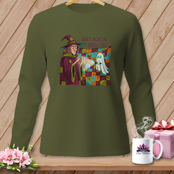 Green long-sleeve shirt with Halloween graphic of a witch and ghost with text.