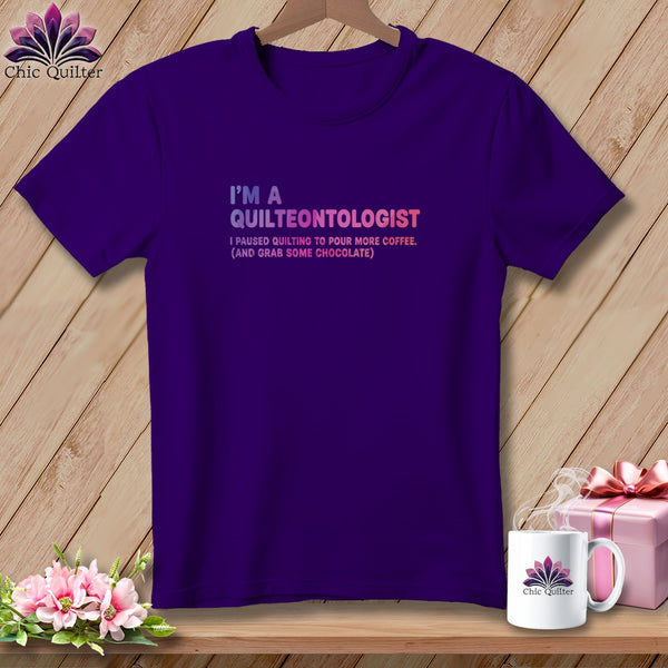 Purple t-shirt with "I'm a Quilteontologist" and coffee/chocolate text.