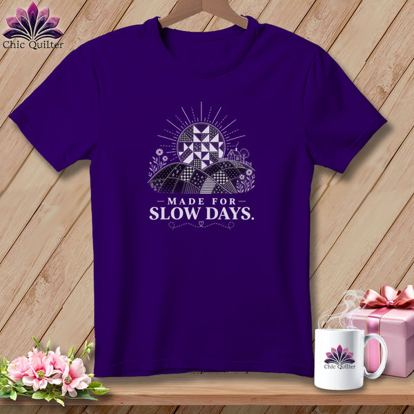 Purple t-shirt with quilted sun graphic and text "MADE FOR SLOW DAYS."
