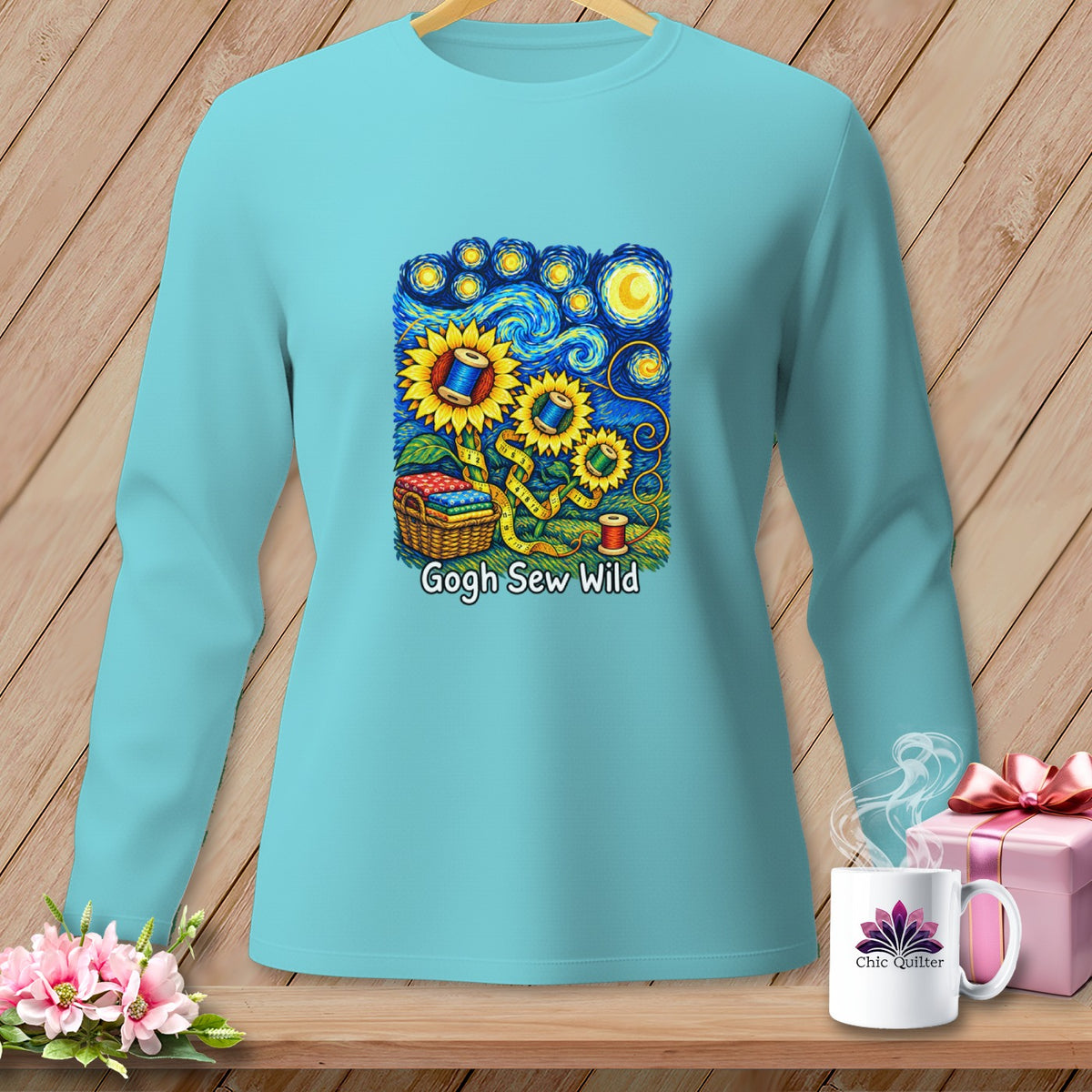 Aqua long sleeve shirt with "Gogh Sew Wild" sewing-themed sunflowers in starry night style.