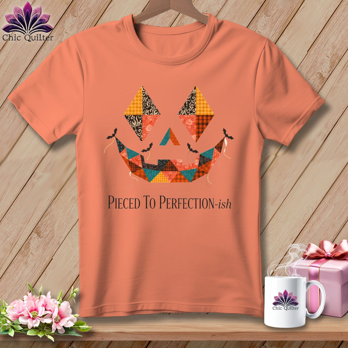 Peach t-shirt with a quilted jack-o'-lantern face and text "Pieced To Perfection-ish".