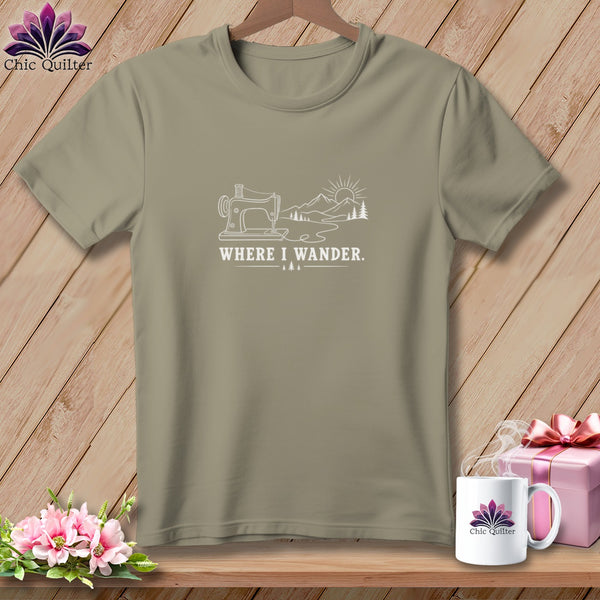 Taupe t-shirt with sewing machine, mountains, and "WHERE I WANDER." text graphic.