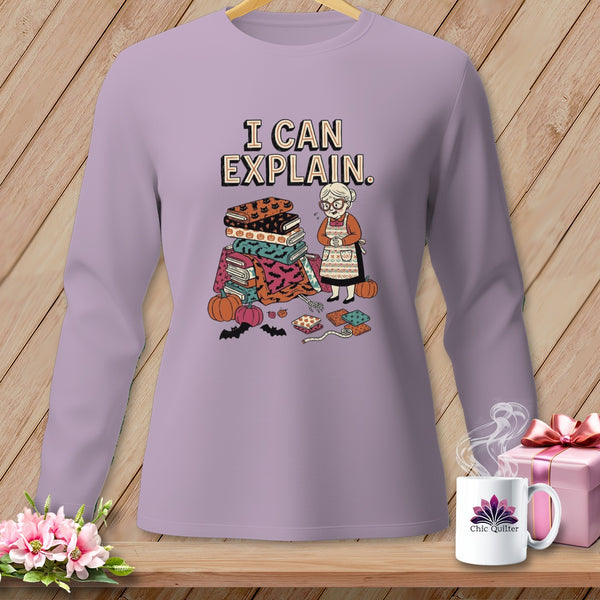Lilac long-sleeve shirt with Halloween-themed quilt blocks and "I CAN EXPLAIN." text.