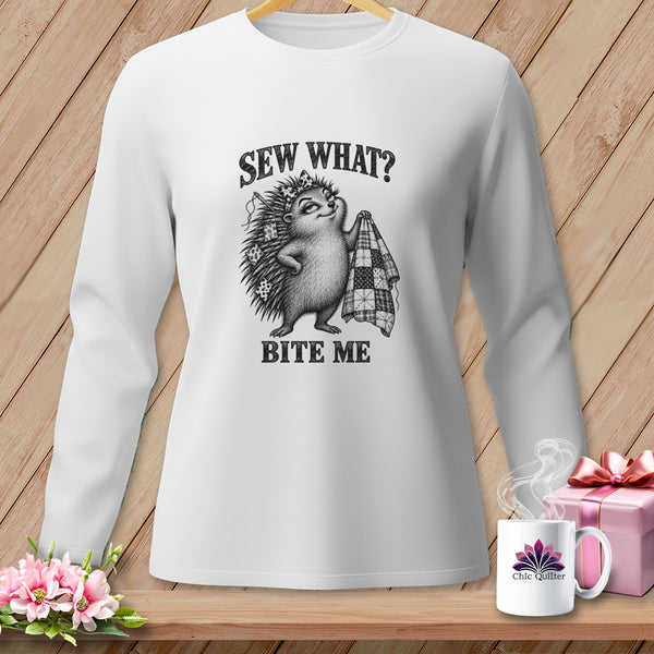 White long-sleeve t-shirt featuring a hedgehog illustration holding a quilt, with text that reads Sew What? Bite Me.