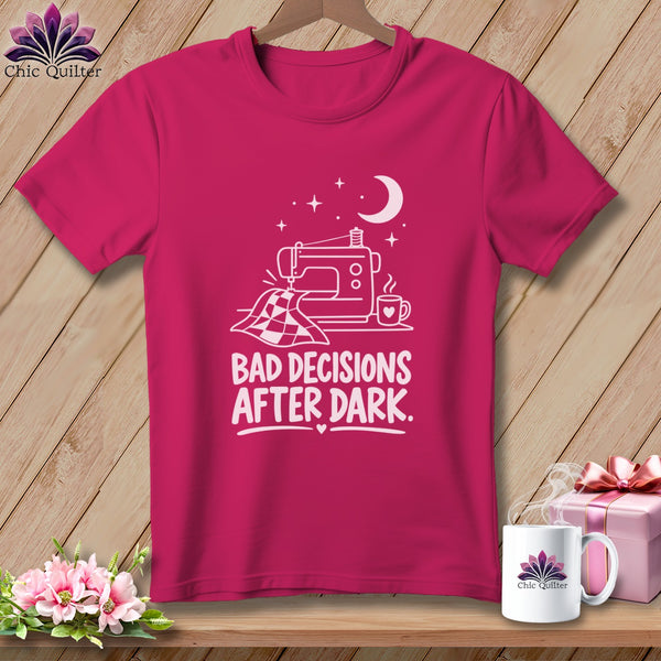 Pink t-shirt with white sewing machine graphic and text "BAD DECISIONS AFTER DARK".