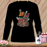 Quilting house illustration with books, thread, and ghosts on a black long-sleeve shirt.