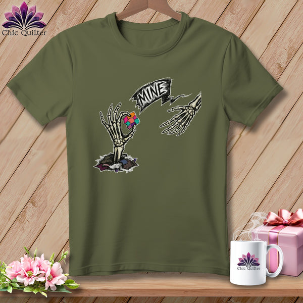 Olive green t-shirt with skeleton hands holding puzzle piece and "MINE" banner.
