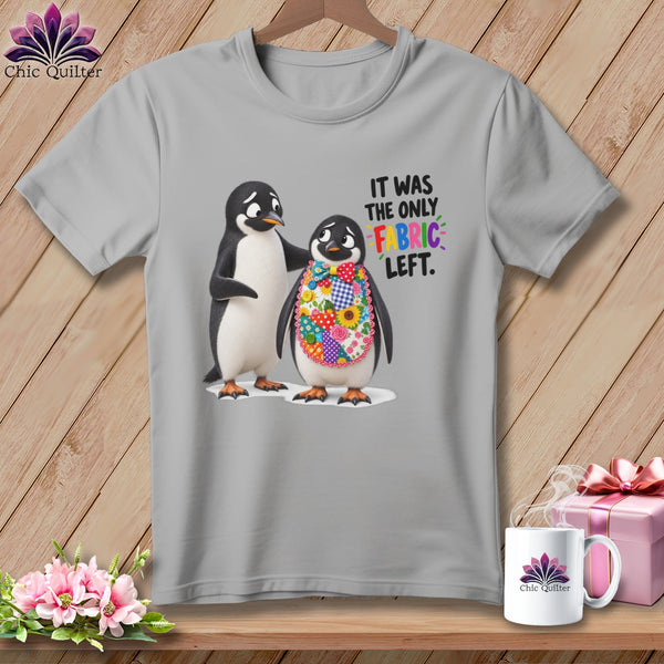 Two penguins, one wearing a patchwork bib, with text "IT WAS THE ONLY FABRIC LEFT."