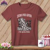 T-shirt with a fox sitting in a chair with a sewing machine and the text 