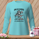 Turquoise long-sleeve shirt with a comical owl ironing a crooked quilt.