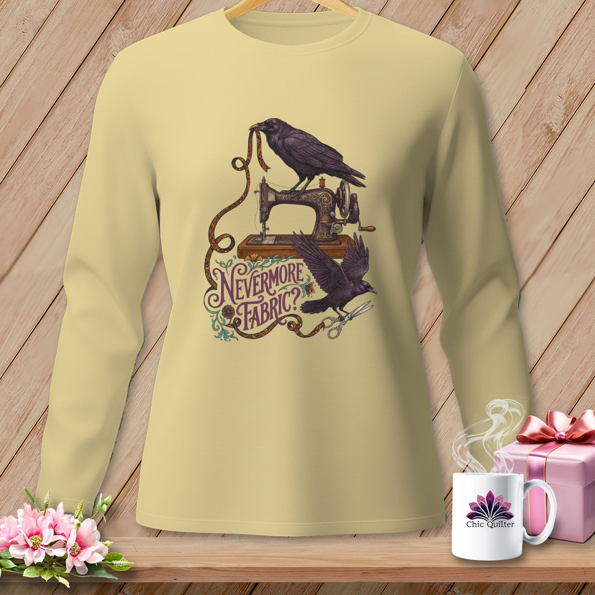 Yellow long-sleeve shirt with ravens, sewing machine, and text "Nevermore Fabric?".